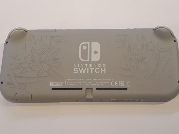 Nintendo Switch Lite Konsoli Harmaa Mukaan kuvassa oleva kotelo ja lataus piuha